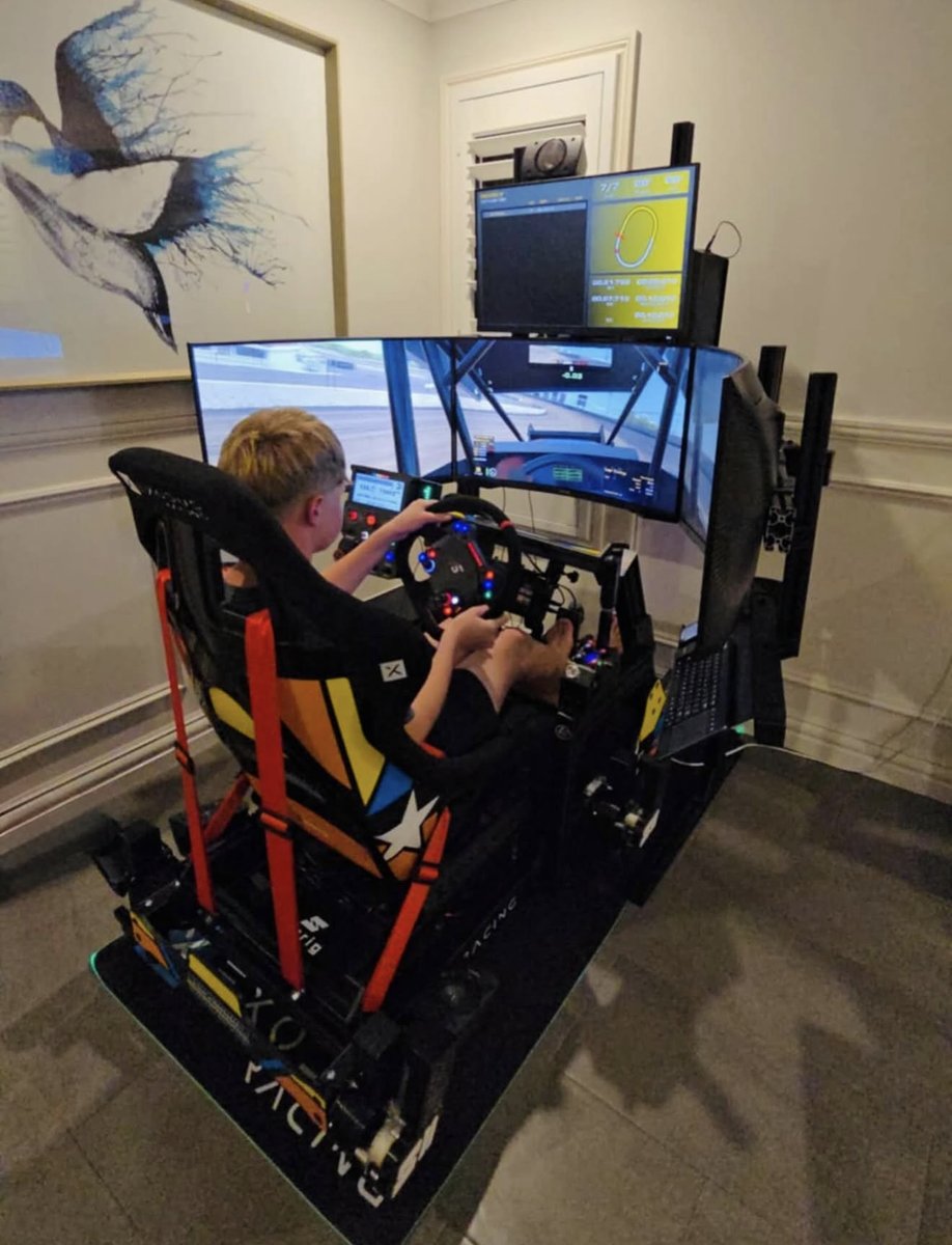 Young racer on custom Exodus XR1 simulator with custom livery