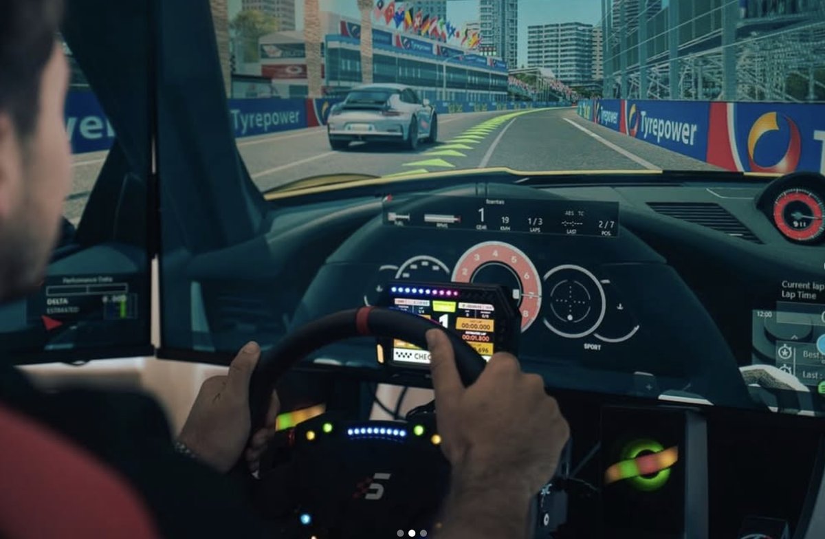 In-cockpit POV with steering wheel telemetry display