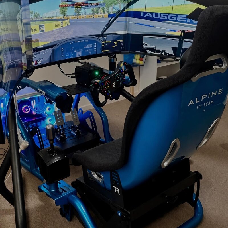 Alpine F1 themed custom racing simulator with triple screens