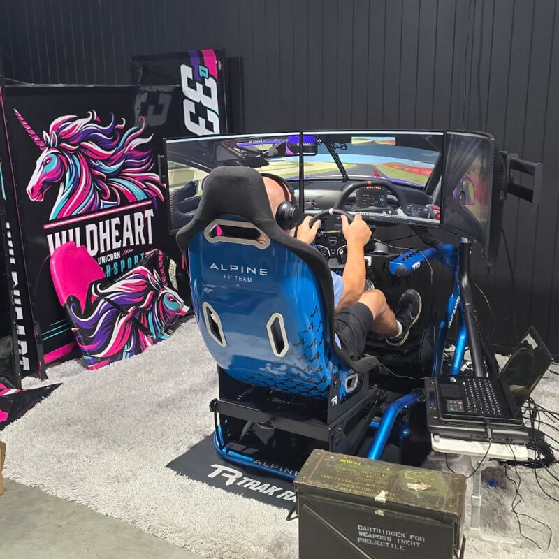 Racer using Alpine simulator at the Everything Simulated showroom